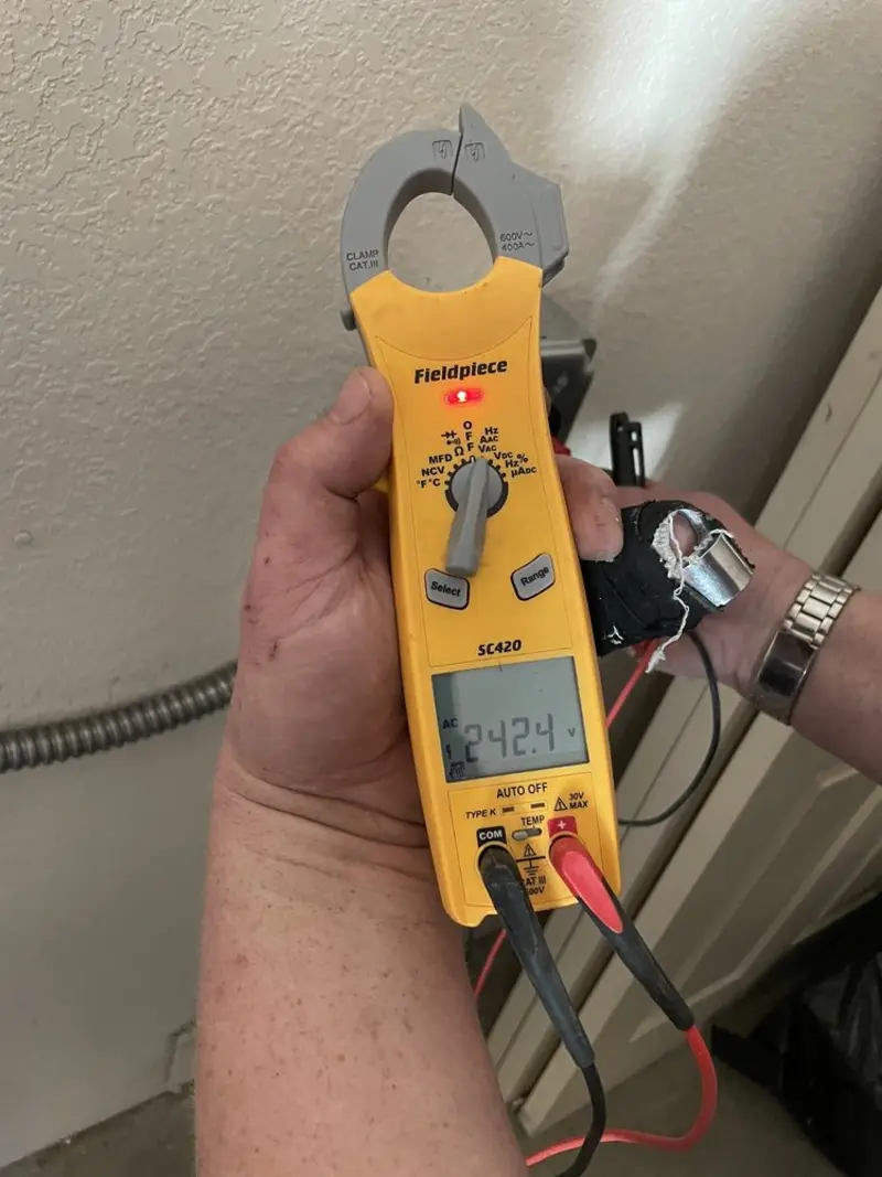 Voltage testing with clamp meter during Whole House Surge Protector in Crittenden